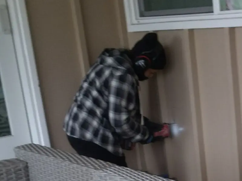 Professional electrician installing an exterior outlet in Jasper